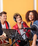 Multiethnic Band Members Performing While Looking stock image Multiethnic Band Members Performing While Looking stock image