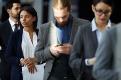 Multiethnic group of business people in line stock images Multiethnic group of business people in line stock images