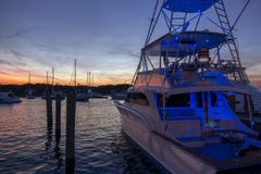 Multilevel motor boat with sunrise sunset sky dark reflections w stock image Multilevel motor boat with sunrise sunset sky dark reflections w stock image