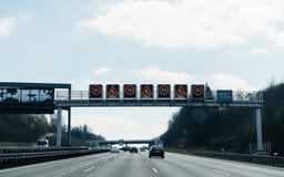 Multiple warning signs above autobahn slow down roadworks royalty free stock photos Multiple warning signs above autobahn slow down roadworks royalty free stock photos
