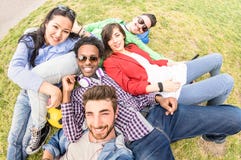Multiracial best friends taking selfie at meadow picnic - Happy friendship fun concept with young people millenials having fun