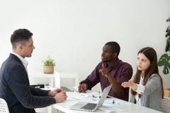 Multiracial colleagues disputing with coworker asking him to lea royalty free stock images Multiracial colleagues disputing with coworker asking him to lea royalty free stock images