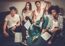 Multiracial music band in a studio royalty free stock image Multiracial music band in a studio royalty free stock image