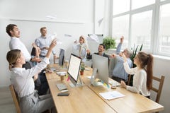 Multiracial team of young and senior people launching paper plan royalty free stock images Multiracial team of young and senior people launching paper plan royalty free stock images