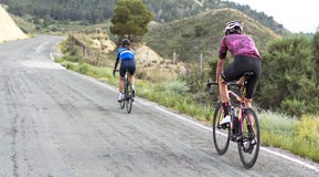 Murcia, Spain, April 17, 2019: Healthy lifestyle - teenage girl and boy cycling royalty free stock photo Murcia, Spain, April 17, 2019: Healthy lifestyle - teenage girl and boy cycling royalty free stock photo
