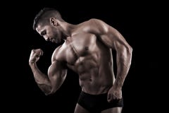 Muscled Man On A Black Background Stock Images