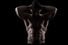 Muscled Man On A Black Background Stock Image