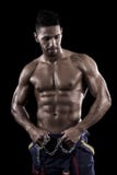 Muscled Man On A Black Background Royalty Free Stock Photography