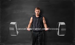 Muscled вес молодого человека поднимаясь нарисованный рукой на предпосылке классн классного стоковая фотография rf Muscled вес молодого человека поднимаясь нарисованный рукой на предпосылке классн классного стоковая фотография rf