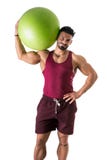 Muscular man holding inflatable fitness ball Royalty Free Stock Photography Muscular man holding inflatable fitness ball Royalty Free Stock Photography