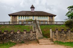 Museum at traditional palace of the Fon of Bafut with brick and tile buildings and jungle environment, Cameroon, Africa Royalty Free Stock Photography Museum at traditional palace of the Fon of Bafut with brick and tile buildings and jungle environment, Cameroon, Africa Royalty Free Stock Photography