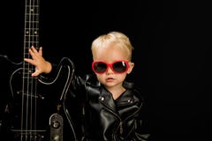 Music for everyone. Adorable small music fan. Small musician. Little rock star. Child boy with guitar. Little guitarist royalty free stock photos Music for everyone. Adorable small music fan. Small musician. Little rock star. Child boy with guitar. Little guitarist royalty free stock photos