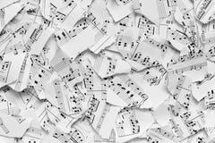 Musical notes on scraps of paper