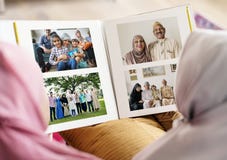 Muslim family looking in a photo album stock photos Muslim family looking in a photo album stock photos