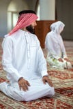 Muslim man and woman praying in mosque Stock Photography Muslim man and woman praying in mosque Stock Photography