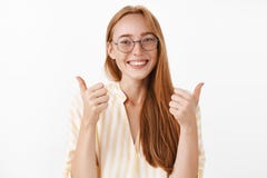 My answer yes. Pleased happy and enthusiastic creative redhead female redhead with cute freckles in glasses and yellow royalty free stock photo My answer yes. Pleased happy and enthusiastic creative redhead female redhead with cute freckles in glasses and yellow royalty free stock photo