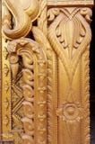Myanmar carving on golden wall. stock photo Myanmar carving on golden wall. stock photo