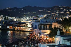 Mykonos, Greece, September 07 2018, Picturesque evening view of Little Venice in Chora full of tourists from all the world stock photo Mykonos, Greece, September 07 2018, Picturesque evening view of Little Venice in Chora full of tourists from all the world stock photo
