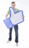 Mężczyzna trzyma Facebook lubi kciuk zdjęcie royalty free Mężczyzna trzyma Facebook lubi kciuk zdjęcie royalty free
