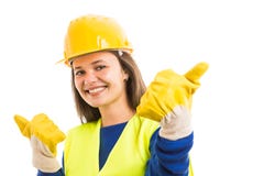 Młoda kobieta architekt pokazuje aprobaty obraz stock Młoda kobieta architekt pokazuje aprobaty obraz stock