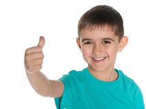 Młoda roześmiana chłopiec trzyma jego kciuk up zdjęcia stock Młoda roześmiana chłopiec trzyma jego kciuk up zdjęcia stock