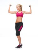 Młoda sporty kobieta z lekkimi dumbbells obraz royalty free Młoda sporty kobieta z lekkimi dumbbells obraz royalty free