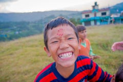 NAGARKOT, NEPAL OCTOBER 11, 2017: Close up of unidentified group of playful little children playing and enjoying time royalty free stock photo NAGARKOT, NEPAL OCTOBER 11, 2017: Close up of unidentified group of playful little children playing and enjoying time royalty free stock photo