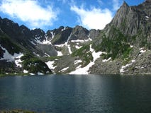 A huge lake surrounded by snowy peaks royalty free stock photo A huge lake surrounded by snowy peaks royalty free stock photo