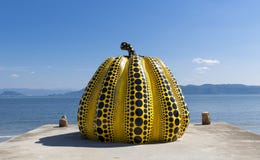 NAOSHIMA, JAPAN. JUNE 6: Yayoi Kusama`s giant pumpkin sculpture stock photo NAOSHIMA, JAPAN. JUNE 6: Yayoi Kusama`s giant pumpkin sculpture stock photo