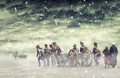 Napoleonic Soldiers And Women Marching In Falling Snow And Pulling A Cannon In Plain Land, Countryside With Stormy Clouds. Soldier Stock Images Napoleonic Soldiers And Women Marching In Falling Snow And Pulling A Cannon In Plain Land, Countryside With Stormy Clouds. Soldier Stock Images
