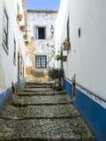 Narrow alley in the old town of Obidos, Portugal Royalty Free Stock Photo Narrow alley in the old town of Obidos, Portugal Royalty Free Stock Photo