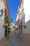 Narrow cobbled colourful back street in Estepona Spain
