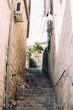 Narrow steep street with steps of ancient town royalty free stock photo Narrow steep street with steps of ancient town royalty free stock photo