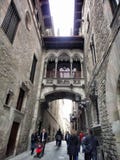 Narrow street Carrer del Bisbe in gothic quarter, Barcelona, Spain Royalty Free Stock Images Narrow street Carrer del Bisbe in gothic quarter, Barcelona, Spain Royalty Free Stock Images