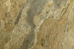 Natural abstract background. The texture of the old yellow stone wall with chinks royalty free stock image Natural abstract background. The texture of the old yellow stone wall with chinks royalty free stock image