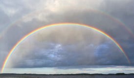 Natural double rainbows plus supernumerary bows