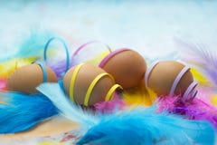 Natural easter eggs with colorful confetti stock photo Natural easter eggs with colorful confetti stock photo