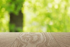 Natural oak table template with blurred oak tree on background Royalty Free Stock Image Natural oak table template with blurred oak tree on background Royalty Free Stock Image