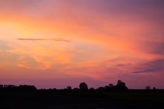 Natural Sunset Sunrise Over Field Or Meadow. Bright Dramatic Sky royalty free stock photos Natural Sunset Sunrise Over Field Or Meadow. Bright Dramatic Sky royalty free stock photos