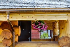 Natural wooden tiles made of larch. Wooden shingles is a unique coating and beautiful roofing and facade material. stock photo Natural wooden tiles made of larch. Wooden shingles is a unique coating and beautiful roofing and facade material. stock photo