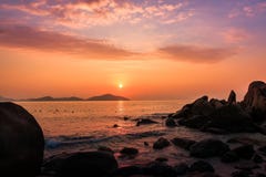 Nature Seascape With Boulders, Islands And Waves At Gorgeous Orange Sunrise Royalty Free Stock Photography