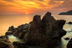 Nature Seascape With Exotic Boulders, Silky Water At Gorgeous Orange Sunrise Royalty Free Stock Photography Nature Seascape With Exotic Boulders, Silky Water At Gorgeous Orange Sunrise Royalty Free Stock Photography