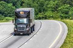 UPS Dual Trailer Rig Travels Interstate With Copy Space Stock Images UPS Dual Trailer Rig Travels Interstate With Copy Space Stock Images