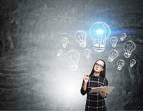 Nerd girl and blue light bulb sketches stock photography Nerd girl and blue light bulb sketches stock photography
