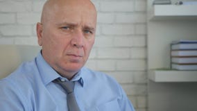 Nervous and Disappointed Businessman Looking to Camera Irritated royalty free stock photography Nervous and Disappointed Businessman Looking to Camera Irritated royalty free stock photography