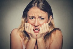 Nervous stressed young woman biting fingernails looking anxiously craving royalty free stock images Nervous stressed young woman biting fingernails looking anxiously craving royalty free stock images