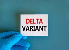 New covid-19 delta variant strain symbol. Doctor hand in blue glove with white card. Concept words `delta variant`. Medical and