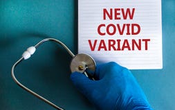 New covid variant symbol. Hand in blue glove with white card. Concept words `New covid variant`. Stethoscope. Medical and COVID-