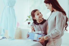 Waist up of delighted family with a present stock image Waist up of delighted family with a present stock image