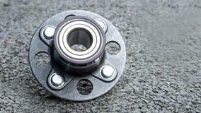 New rear wheels car bearing on asphalt floor in garage and copy Stock Image New rear wheels car bearing on asphalt floor in garage and copy Stock Image